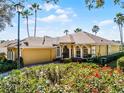 House exterior with a landscaped yard and palm trees at 4 Arika At Lionspaw, Daytona Beach, FL 32124