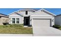 Two-car garage and well-maintained lawn at 648 Daring Dr, Davenport, FL 33837