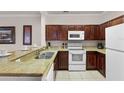 Modern kitchen with granite countertops and appliances at 8020 Tuscany Way # 6401, Davenport, FL 33896