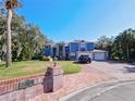 Two-story home with blue siding, double garage, and landscaping at 2395 Windward Cv, Kissimmee, FL 34746