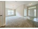 Bright and spacious dining area with large windows and neutral carpeting at 4456 Sagefield Dr, Harmony, FL 34773