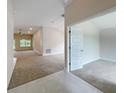Open and airy entryway with views into the living and dining areas at 4456 Sagefield Dr, Harmony, FL 34773