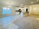 Open concept kitchen with granite countertops and stainless steel appliances at 4464 Sagefield Dr, Harmony, FL 34773
