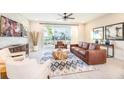 Comfortable living area with a sliding glass door to outdoor space and contemporary furnishings at 7925 Putting Green Way, Reunion, FL 34747