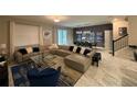 Open living area with sectional sofa, dining area, and access to backyard at 1178 Drop Ln, Kissimmee, FL 34747