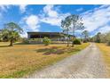 Covered riding arena with a gravel surface at 2140 W State Road 46, Geneva, FL 32732