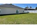 Large backyard with a privacy fence and grassy area at 2621 Sw 152Nd Ln, Ocala, FL 34473