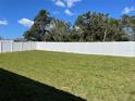 Spacious backyard with a large grassy area and privacy fence at 2621 Sw 152Nd Ln, Ocala, FL 34473