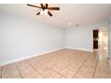 Open concept living room with neutral walls and tile floors at 3208 Oak Lawn Pl # 218, Winter Park, FL 32792