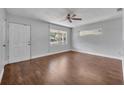 Bright living room features hardwood floors, ceiling fan and lots of natural light at 3309 Drake Dr, Orlando, FL 32810