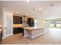 Modern kitchen features sleek countertops, stainless steel appliances, and an open layout at 4425 Lions Gate Ave, Clermont, FL 34711