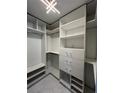 Large walk-in closet with ample shelving and hanging space at 4854 S Semoran Blvd # 2203, Orlando, FL 32822