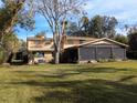 Two-story home with a large screened porch at 9430 Kilgore Rd, Orlando, FL 32836