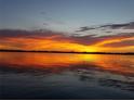 Spectacular sunset over calm lake waters at 9430 Kilgore Rd, Orlando, FL 32836