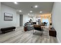 Open floor plan features a living room with modern decor flowing into the kitchen and dining areas at 150 Marion Oakes Trl, Ocala, FL 34473