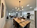 Inviting living space with open floor plan connecting dining, kitchen and living areas at 150 Marion Oakes Trl, Ocala, FL 34473