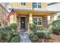 Inviting front porch with stonework and landscaping at 15524 Aviation Aly, Winter Garden, FL 34787