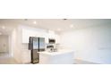 Modern kitchen with stainless steel appliances and island at 1655 Andover Ridge Dr, Deland, FL 32720