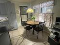 Cozy kitchen with granite counters and gray cabinets at 247 Cranbrook Dr, Kissimmee, FL 34758