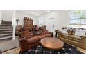 Spacious living room with two brown sofas and a coffee table at 2559 Relaxing Ln, Kissimmee, FL 34747