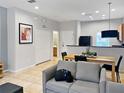 Open concept living area with dining area and kitchen at 3002 Red Ginger Rd, Kissimmee, FL 34747