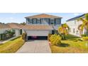 This well-kept home includes a two-car garage and tasteful landscaping enhancing curb appeal at 361 Preserve Pointe Blvd, Davenport, FL 33837