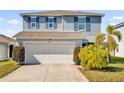 Charming two-story home with a well-maintained lawn and a two-car garage provides ample parking at 361 Preserve Pointe Blvd, Davenport, FL 33837