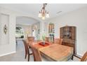 Elegant dining room with hardwood table and built-in hutch at 4292 Lillian Hall Ln, Orlando, FL 32812