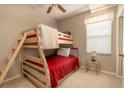 Bedroom with a wooden bunk bed and a small nightstand at 5999 Lake Pointe # 609, Orlando, FL 32822