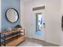 Bright and spacious entryway with a modern console table and mirror at 672 Preston Cove Dr, St Cloud, FL 34771