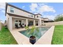 Backyard pool features a sun deck and is surrounded by a well-maintained lawn at 9573 Meadow Hunt Way, Winter Garden, FL 34787