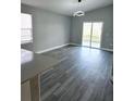 Bright and airy living room with sliding glass doors to the backyard at 1057 Inkberry Ct, Orlando, FL 32811