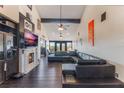 Open living area with a large sectional sofa, fireplace, and high ceilings at 13145 Paloma Rd, Clermont, FL 34711