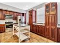 Well-equipped kitchen boasts ample cabinet space and modern appliances for the discerning chef at 1331 Common Way Rd, Orlando, FL 32814