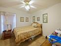 Cozy bedroom with natural light, neutral color scheme, and decorative touches at 1614 Stanbury Dr, Orlando, FL 32818