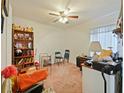 A functional bedroom with standard ceiling fan, window and closet storage solutions at 1614 Stanbury Dr, Orlando, FL 32818