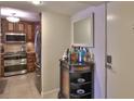 Inviting entryway with a view of the kitchen area and decorative table at 4175 S Atlantic Ave # 232, New Smyrna Beach, FL 32169