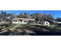 House with detached building, fenced yard, and trees at 421 Sw 23Rd St, Ocala, FL 34471