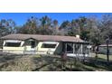 House with chain link fence and mature trees at 421 Sw 23Rd St, Ocala, FL 34471