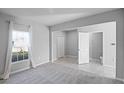 Spacious bedroom featuring a large window for natural light and an ensuite bathroom at 514 Eagle Landing Blvd, Winter Haven, FL 33880
