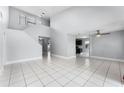Bright living room with high ceilings, neutral paint, and ample natural light from the open floor plan at 119 Floral Ct, Kissimmee, FL 34743