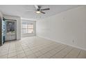 Bright living room featuring tile floors and a ceiling fan at 208 Diamond Cv # 104, Casselberry, FL 32707