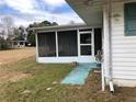 Screened porch and walkway leading to backyard at 34847 Learn Rd, Leesburg, FL 34788