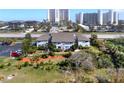 Beautiful multi-Gathering home featuring a well-manicured lawn, mature trees, and ample parking for residents and guests at 4411 Sea Mist Ct # 174, New Smyrna Beach, FL 32169