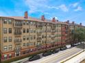Beautiful exterior view of the multiple units with brick accents and private balconies overlooking the street at 911 N Orange Ave # 352, Orlando, FL 32801