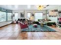 Spacious living room with tile flooring, colorful decor, and lots of natural light at 9263 Lake Lotta Cir, Gotha, FL 34734
