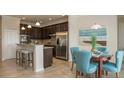 Kitchen with breakfast nook, granite countertops, and stainless steel appliances at 1575 Weaver Oak Way, Deland, FL 32720