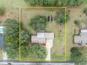 Property view showcasing house, large yard, and a shed at 2770 Windsong Ln, St Cloud, FL 34772