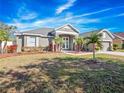 Landscaped front yard of a one-story house at 3291 Pawleys N Loop, St Cloud, FL 34769