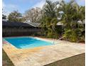 Inviting rectangular pool with light-colored stone decking at 3458 Balsam Dr, Winter Park, FL 32792